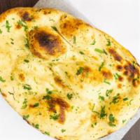 Garlic Naan · Vegetarian. Garlic naan and Indian flatbread topped with garlic and cilantro.