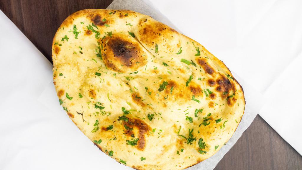 Garlic Naan · Vegetarian. Garlic naan and Indian flatbread topped with garlic and cilantro.