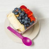 Acai Bowl · Organic acai soft serve with your choice of three toppings drizzled with blue agave! Dairy f...
