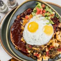 Huevos Rancheros · Tortilla, home fries, pintos, Cheddar chile and two eggs bacon, ham, sausage and carne for a...