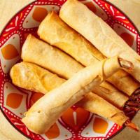 Sleeping Prawn · Deep Fried Shrimp wrapped in egg rolls wrapper served with sweet and sour sauce