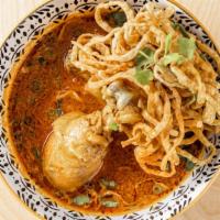 Khao Soi · Northern style curry sauce with egg noodle, green onion, shallots, fried onion, cilantro, li...