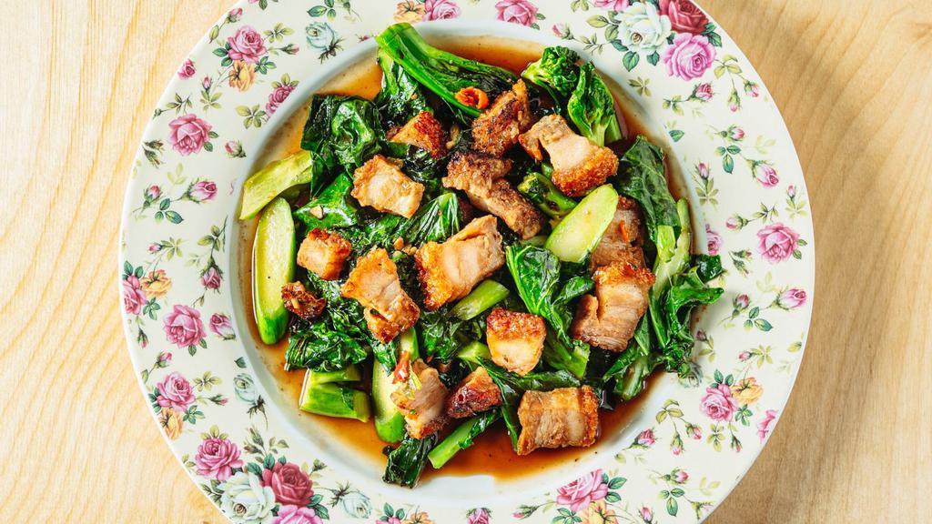 Kana Moo Krob · Stir fried Chinese broccoli with Thai chili and crispy pork belly served with jasmine rice.