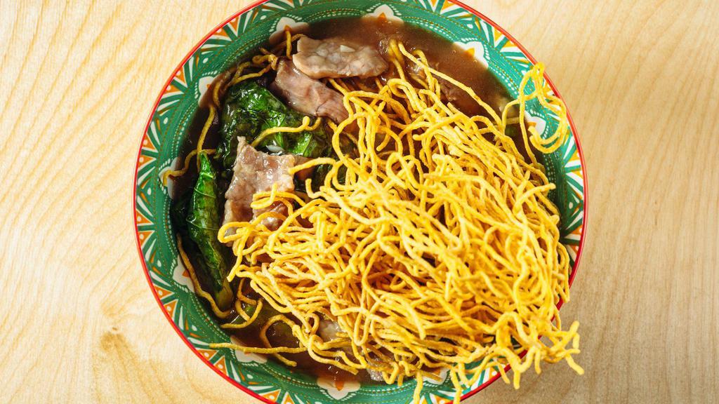 Mee Krob Rad Nah · Crispy egg noodle with gravy sauce, marinated meat and Chinese broccoli.