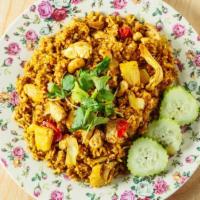 Pineapple Fried Rice · Yellow curry powder flavor stir fried with egg, pineapple, tomato, cashew nut and raisins.
