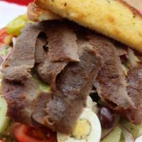 Gyro Greek Salad · Gyro Meat, Lettuce, Tomatoes, Cucumbers, Boiled Egg, Olives, Red Onions, Pepperoncini, Feta ...