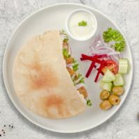 Vegan Falafel Gyro · Falafel in hot pita bread served with tomatoes, lettuce onions, green peppers. House-made sa...