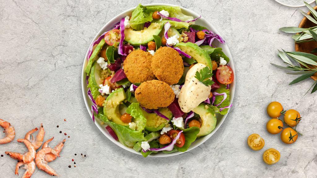 Vegan Falafel Salad · Lettuce, tomatoes, onions, peppers, pickled turnips, cucumbers, comes with olive oil, and hummus.
