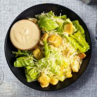 Caesar Who? Salad · Crispy romaine tosses with croutons, Caesar dressing, and grated cheese.