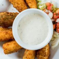 Jalapeño Poppers · Juicy jalapeno poppers breaded and filled with cheese and fried to golden perfection.