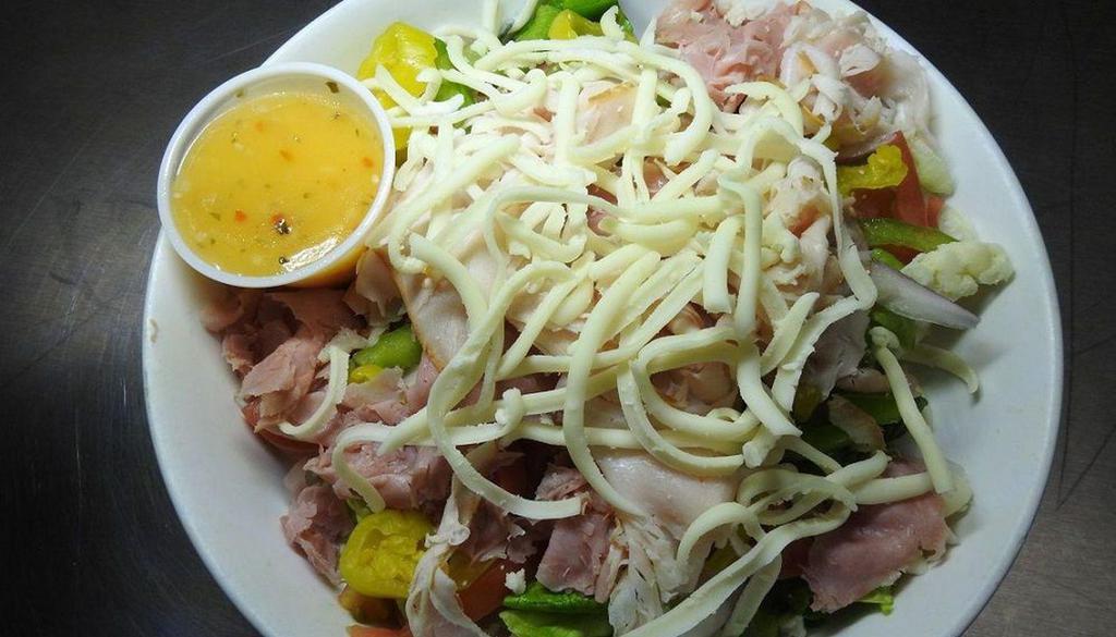 Chef Salad · Fresh garden salad topped with turkey, ham, cheese & your choice of dressing.