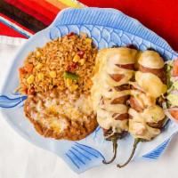 Chiles Crossroads · Two anaheim green peppers stuffed with shrimp ranchero, wrapped with bacon and  topped with ...