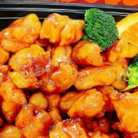 Crispy Orange Chicken · Lightly dusted chicken coated with a tangy orange sauce.