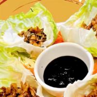 Little Hong Kong Lettuce Wraps · Fresh lettuce stuffed with minced chicken, water chestnuts, and mushrooms, sautéed in a rich...