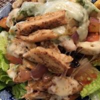 Pesto Chicken Salad · Deliciously seasoned chicken served with pesto and melted provolone cheese, on a bed of fres...