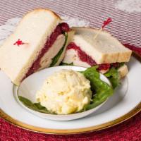Turkey Gobbler · Turkey, lettuce, cream cheese and cranberry served on sourdough