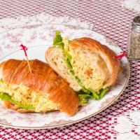 Almond Chicken Sandwich · A croissant filled with shredded curry chicken, slivered almonds, and a light spread of hone...