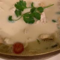 Tom Kha · Coconut milk soup with galangal, lemongrass, fennel, cherry tomato, and mushroom.
