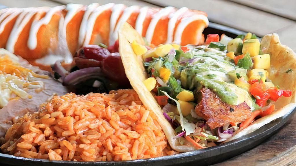 Seafood Combo · Lobster and crab enchilada and signature fish taco.  Served with Mexican rice and refried beans.