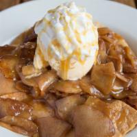 Caramel Apple Pie Nacho · Simmered Granny Smith apples covered with warm, gooey caramel over crispy cinnamon flour tor...