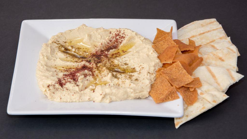 Hummus  (Vegetarian) · Vegetarian. Mashed chickpeas, blended with tahini, garlic, lemon. Topped with olive oil. Served with warm pita bread.