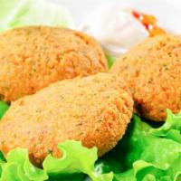 Falafel Balls · Ground chickpeas patties blended with parsley, onions, garlic, and seasonings. Deep fried to...