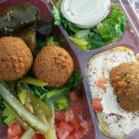 Falafel Over Salad · 4 Vegetarian. Deep fried vegetable patties made with chickpeas and spices. Served over green...