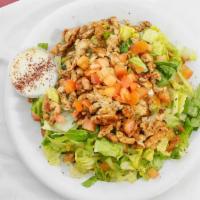 Chicken Shawarma Over Salad · Marinated and seasoned white breast chicken grilled served over mixture of  lettuce, tomatoe...