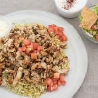 Grilled Chicken Shawarma Platter · Marinated and seasoned white breast chicken. Served over basmati rice with Greek salad, fatt...