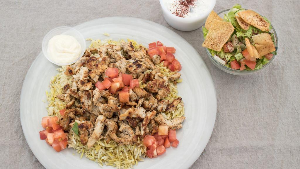 Grilled Chicken Shawarma Platter · Marinated and seasoned white breast chicken. Served over basmati rice with Greek salad, fattoush salad, and tzatziki sauce.