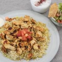 Grilled Chicken Shish Kabob Platter · Breast chicken with barbecue seasoning grilled topped with creamy garlic sauce. Served over ...