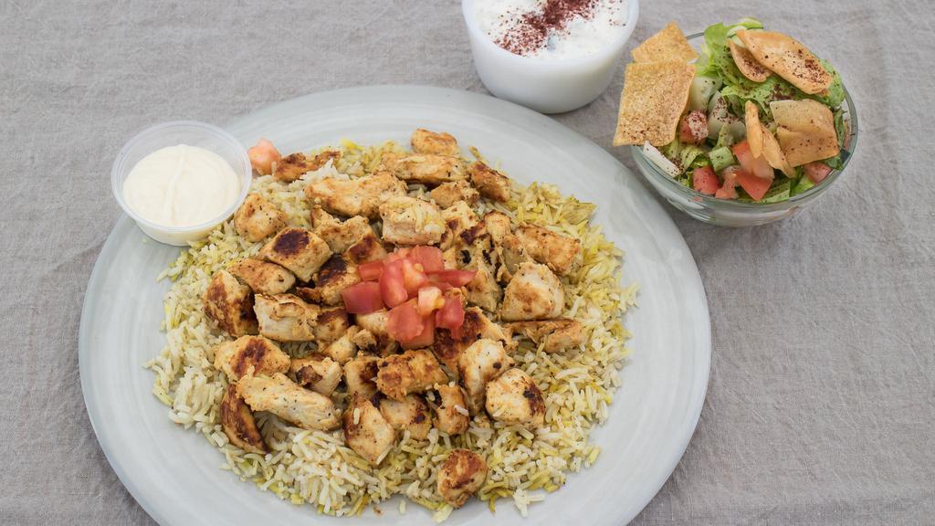 Grilled Chicken Shish Kabob Platter · Breast chicken with barbecue seasoning grilled topped with creamy garlic sauce. Served over basmati rice with Greek fattoush salad, and tzatziki sauce.