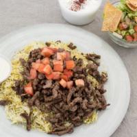 Grilled Beef Shawarma Platter · Seasoned beef grilled. Served over basmati rice with Greek salad, fattoush salad, and tzatzi...