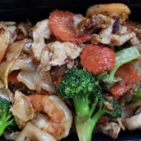 Pad See Ew · Stir-fried wide rice noodles in sweet soy sauce with
your choice of meat, egg, carrot, garli...