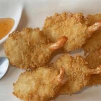 Coconut Prawns · Whole prawn tossing with coconut flake and deep fried to golden tender. Served with palm sau...