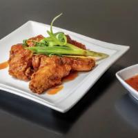 Chicken Wings · Deep fried chicken wings, served with sweet and sour sauce. Marinated with soy sauce, salt, ...