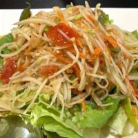 Som Tum · Papaya salad is a dish with a combination of tropical fruit and vegetables, green papaya, ch...