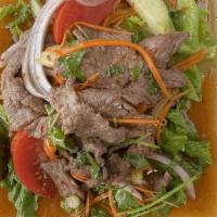 Yum Nuea (Beef Salad) · Beef salad with roasted chilies, veggies and lime juice
cucumber, tomato, shallot, green oni...