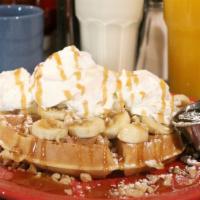 Caramel Banana Waffle · Topped with walnuts, bananas, whipped cream, powdered sugar, and caramel sauce.