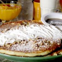 Banana Walnut · Short stack, fresh bananas, walnuts, topped with whipped cream and powdered sugar.