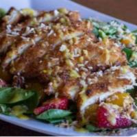 Caribbean Salad · Coconut fried chicken, spinach, strawberries, mandarin oranges, candied pecans, and shredded...