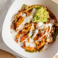 Burrito Bowl · Your choice of marinated steak, chicken, pork or shrimp.  Sauteed with bell peppers, onions,...