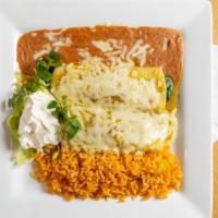 Spinach Enchiladas · Spinach sautéed with mushrooms, onions, tomatoes, and cilantro rolled into two corn tortilla...
