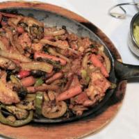 Vegetarian Fajitas · Mushrooms, carrots, broccoli, cauliflower, bell peppers, onions and tomatoes. Served with ri...