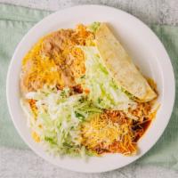 1 Shredded Beef Taco And 1 Enchilada · 1 shredded beef taco, with and enchilada. served with rice, beans,cheese,lettuce,and enchila...