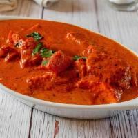 Chicken Tikka Masala · Boneless chicken cubes cooked with fresh tomatoes, herbs, and creamy tomato sauce. Served wi...