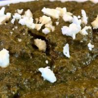 Saag Paneer · Creamy spinach blended with fried cheese cubes and spices. Served with side basmati rice.