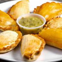 Empanadas · Homemade pastry dough stuffed with:
-Natural grass  fed beef (from Canyon Meadows Ranch)
-Ch...
