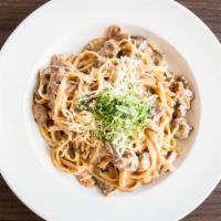 Beef Stroganoff · Fettuccine noodles with chunks of filet mignon in a brown sauce with mushrooms, shallots, he...