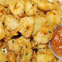 Cheese Curds · Wisconsin white cheddar cheese curds breaded and deep fried served with house marinara or ra...
